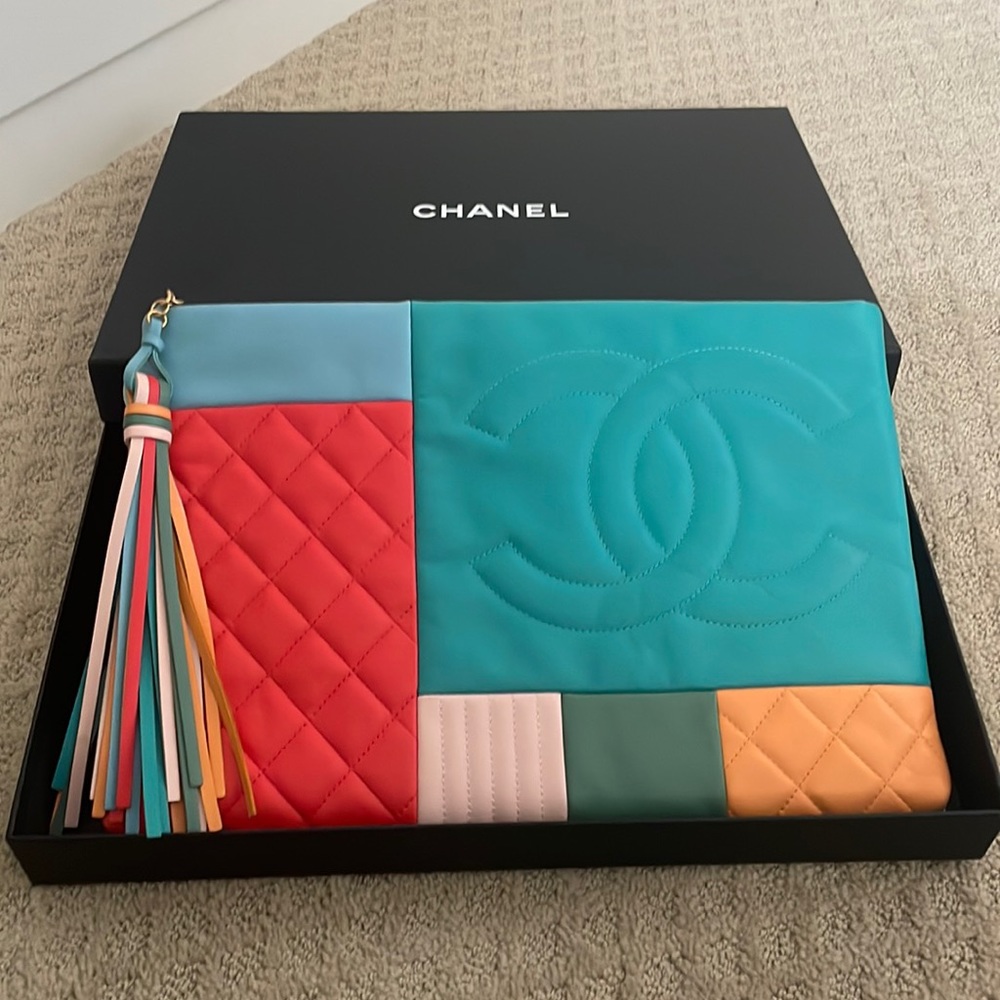 Authentic multicolor Chanel clutch great for vacations never been worn.